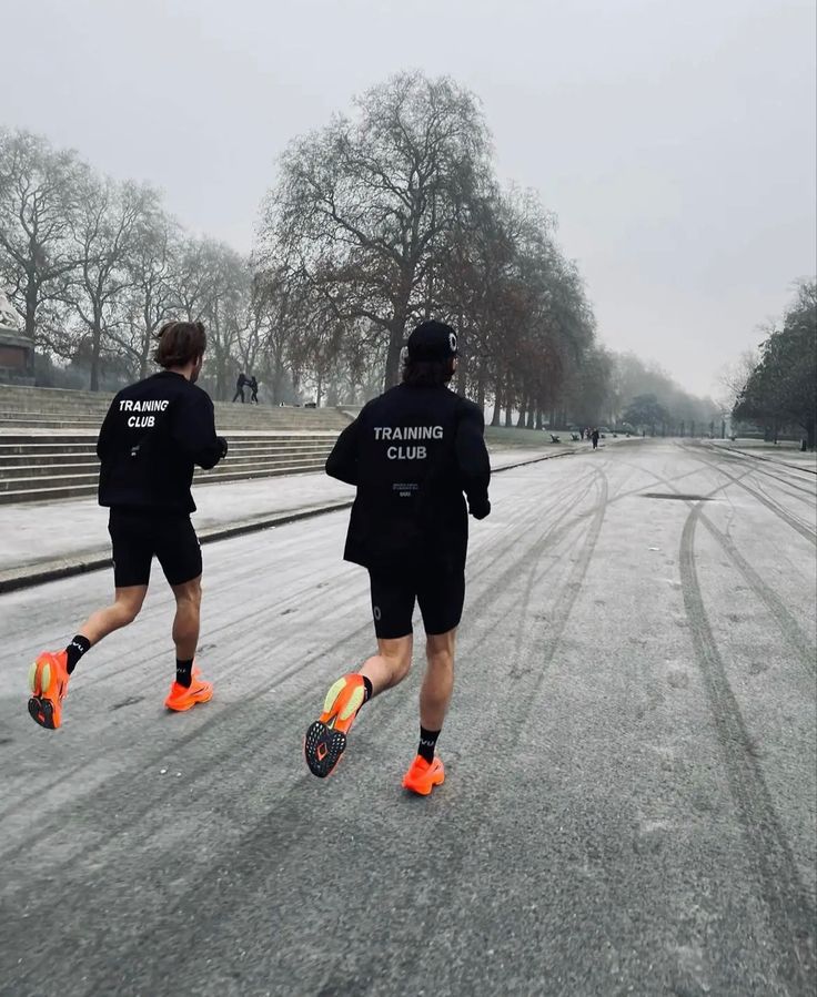 Two young men running 