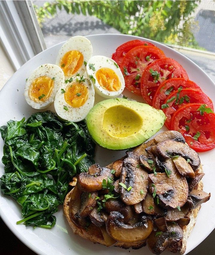 A healthy bowl containing all three macronutrients: eggs for protein, avocado for healthy fats, and colorful veggies for carbohydrates.